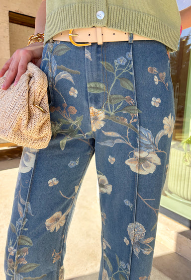 Fresh, fun, and effortlessly wearable, these medium wash wide leg jeans by Entro are a perfect way to bring florals into your spring denim lineup. Featuring a muted floral print throughout, they add subtle interest while still feeling easy to style. The exposed seam down the front gives a flattering, elongating look, and the wide leg silhouette keeps them relaxed and on-trend. These are the kind of jeans that make even a simple tee feel styled.