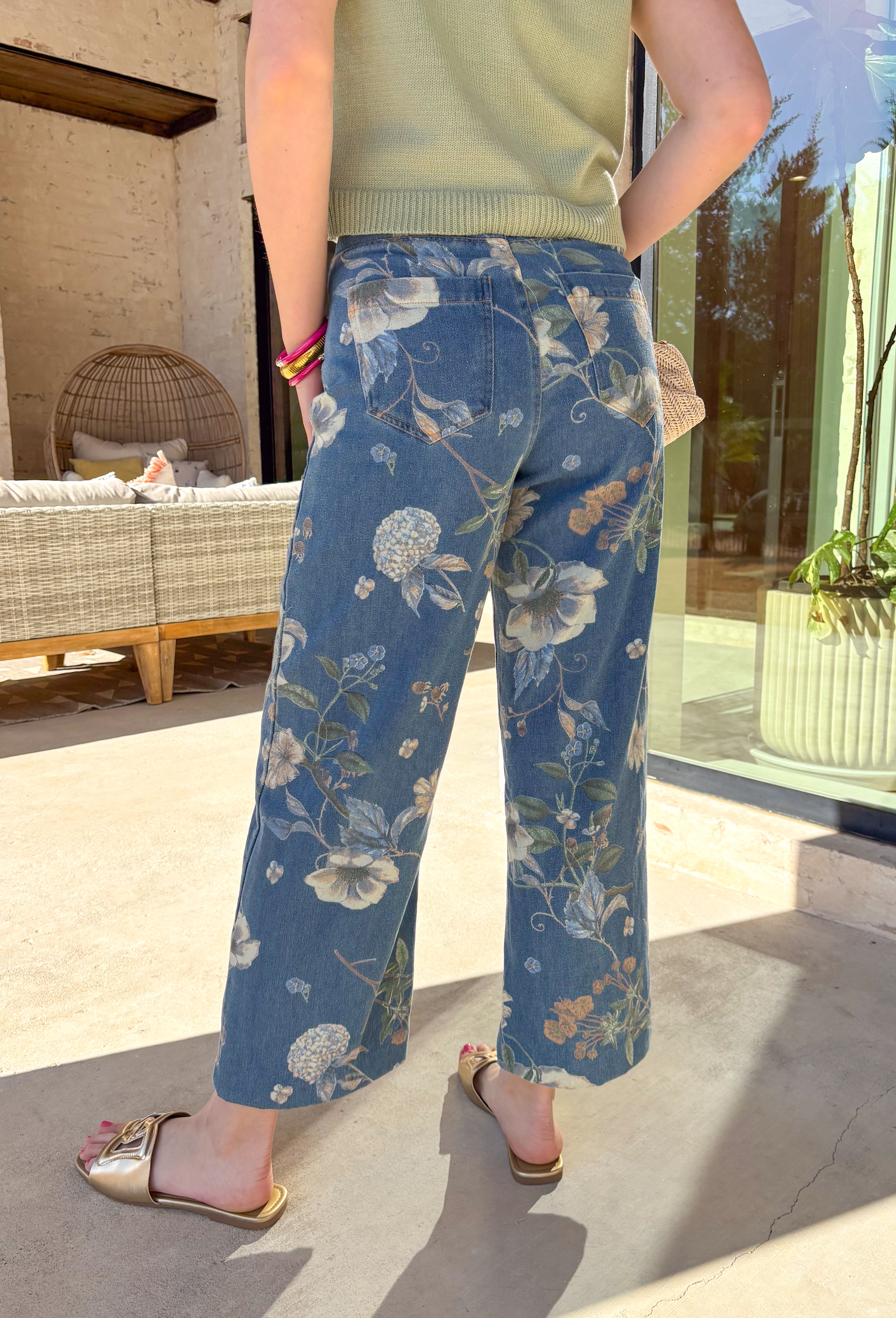 Fresh, fun, and effortlessly wearable, these medium wash wide leg jeans by Entro are a perfect way to bring florals into your spring denim lineup. Featuring a muted floral print throughout, they add subtle interest while still feeling easy to style. The exposed seam down the front gives a flattering, elongating look, and the wide leg silhouette keeps them relaxed and on-trend. These are the kind of jeans that make even a simple tee feel styled.