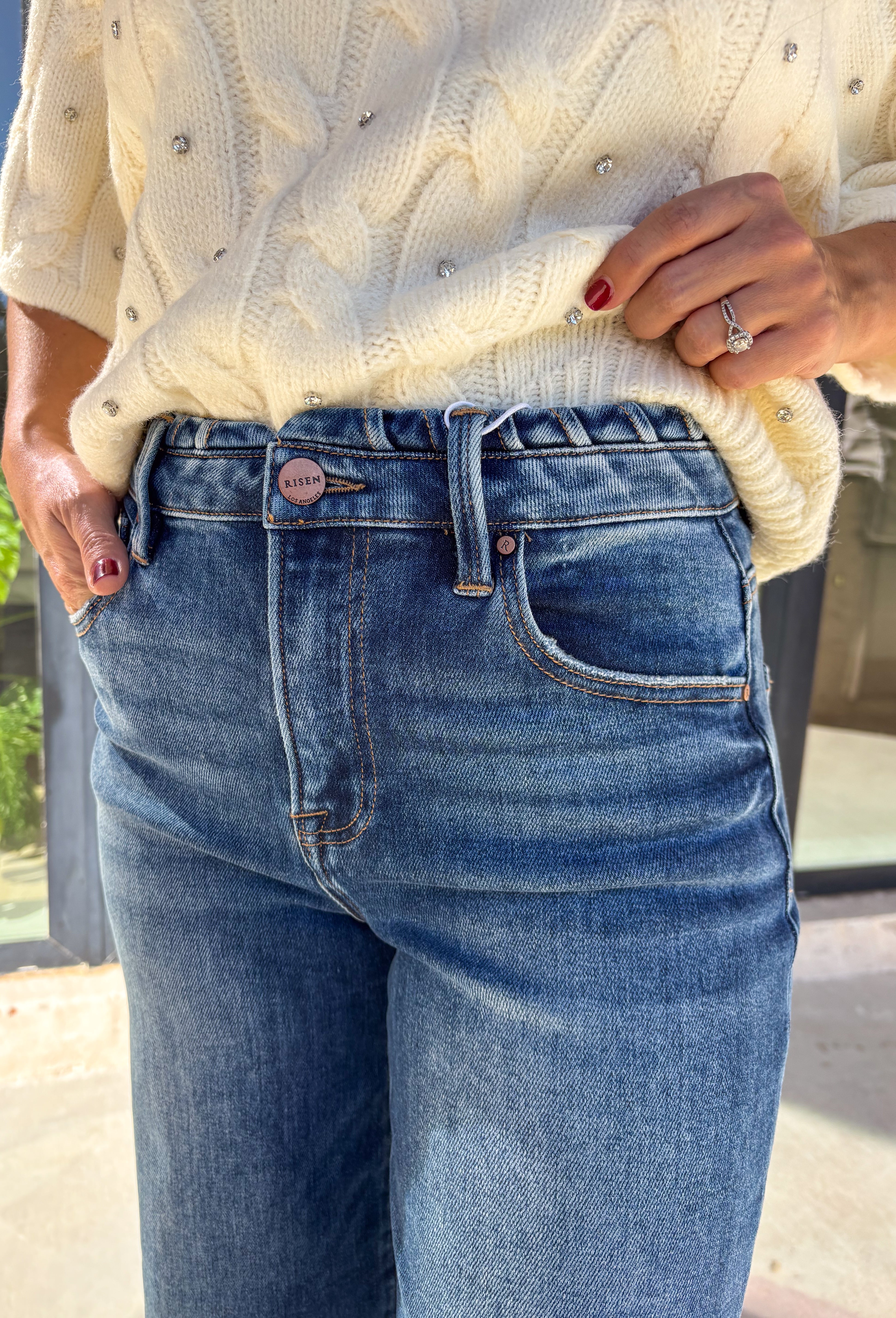 A timeless denim favorite for the season, these dark wash wide leg jeans by Risen are a must-have in every winter wardrobe. Designed with a flattering high-rise fit and a clean, classic finish, they’re easy to dress up or down. The soft stretch denim offers all-day comfort while maintaining their structured look—perfect for pairing with cozy sweaters or sleek boots.