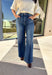 A timeless denim favorite for the season, these dark wash wide leg jeans by Risen are a must-have in every winter wardrobe. Designed with a flattering high-rise fit and a clean, classic finish, they’re easy to dress up or down. The soft stretch denim offers all-day comfort while maintaining their structured look—perfect for pairing with cozy sweaters or sleek boots.