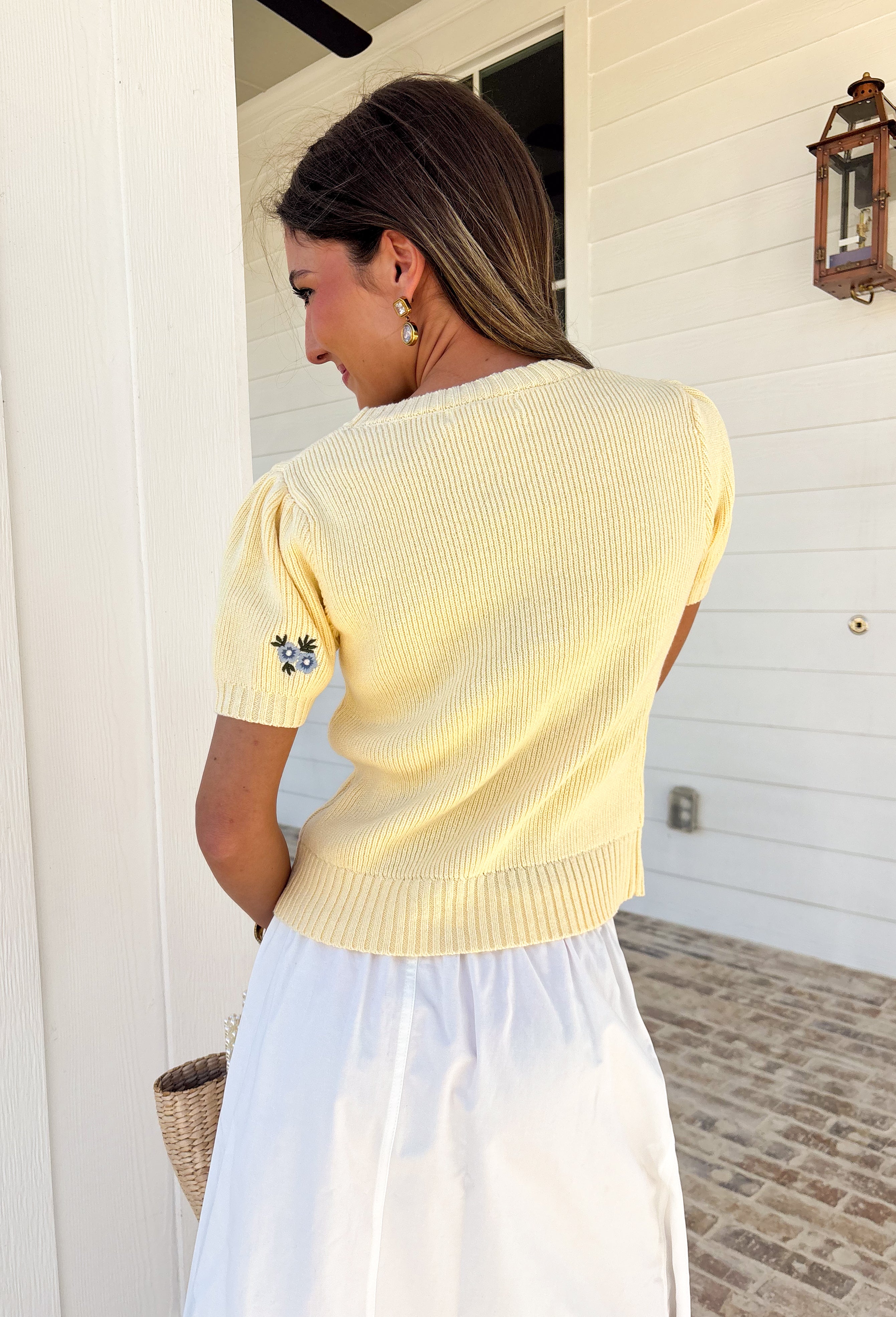 Soft, cheerful, and made for sunny days! This butter yellow ribbed sweater features the prettiest blue embroidered floral print that adds a fresh pop of color to your everyday look. The ribbed texture gives it a flattering, easy fit while the delicate embroidery brings in that sweet, spring-ready feel.Lightweight and comfortable, this short sleeve sweater is perfect for transitioning between seasons. 