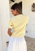 Soft, cheerful, and made for sunny days! This butter yellow ribbed sweater features the prettiest blue embroidered floral print that adds a fresh pop of color to your everyday look. The ribbed texture gives it a flattering, easy fit while the delicate embroidery brings in that sweet, spring-ready feel.Lightweight and comfortable, this short sleeve sweater is perfect for transitioning between seasons. 