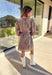 This mocha long sleeve dress by Entro captures all the warmth and charm of fall. Featuring a botanical floral print in rich autumn shades, it’s designed with a flattering v-neckline and a self-tie belt to define the waist. Side pockets and a full lining make it as practical as it is stylish, while the soft cotton fabric keeps it comfortable all day long. A perfect go-to for weekend plans, fall photos, or seasonal get-togethers.