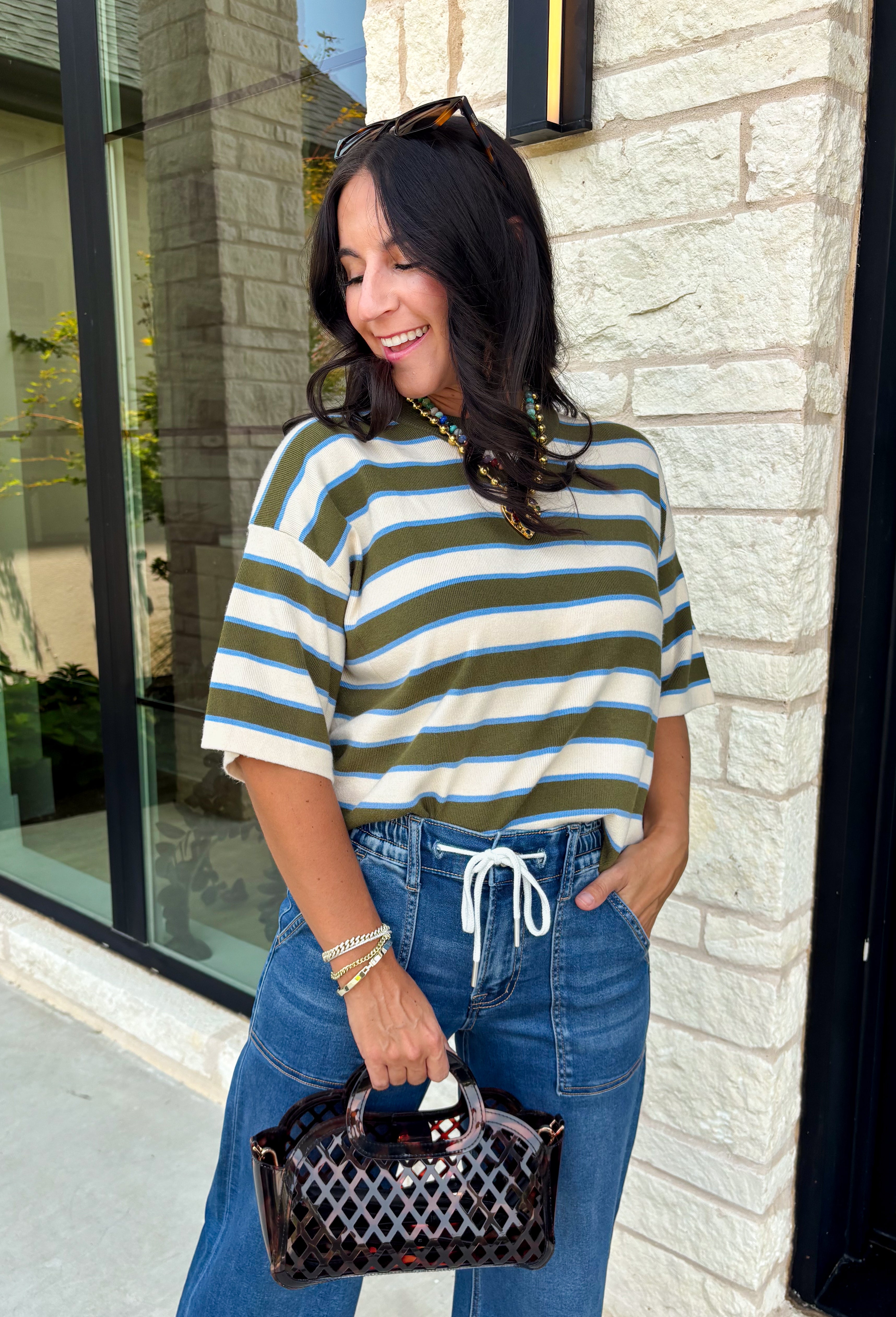 Wrap yourself in effortless comfort with a sweater that's made for all your favorite fall moments! This cozy ribbed knit blends soft off white, light blue, and olive tones into a timeless color palette that's easy to style throughout the season. The lightweight feel makes it perfect for layering without adding bulk, while the 3/4-length sleeves offer just the right amount of coverage for crisp mornings and sunny autumn afternoons. 
