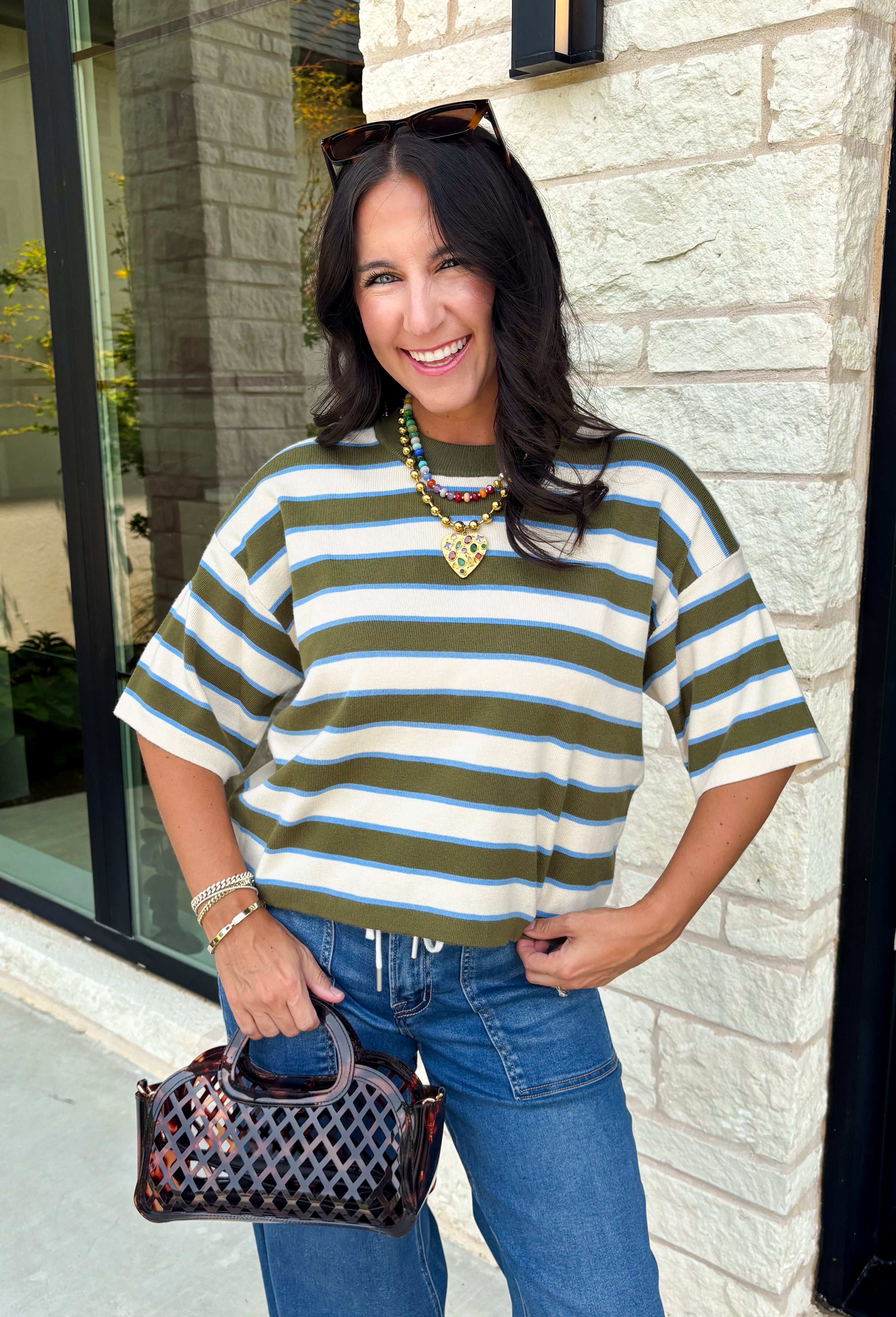 Wrap yourself in effortless comfort with a sweater that's made for all your favorite fall moments! This cozy ribbed knit blends soft off white, light blue, and olive tones into a timeless color palette that's easy to style throughout the season. The lightweight feel makes it perfect for layering without adding bulk, while the 3/4-length sleeves offer just the right amount of coverage for crisp mornings and sunny autumn afternoons. 