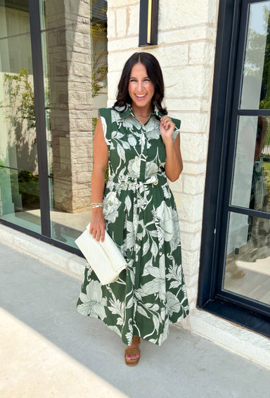 Fresh florals and timeless details come together in this effortlessly beautiful midi dress that's ready for every occasion on your calendar! Designed in a rich fern green with a neutral floral print, this cotton dress brings an easy elegance to your everyday wardrobe. The button-front bodice, self-tie waist belt, and flowy midi silhouette create a flattering fit you'll love, while the side pockets and fully lined design make it as practical as it is pretty. 