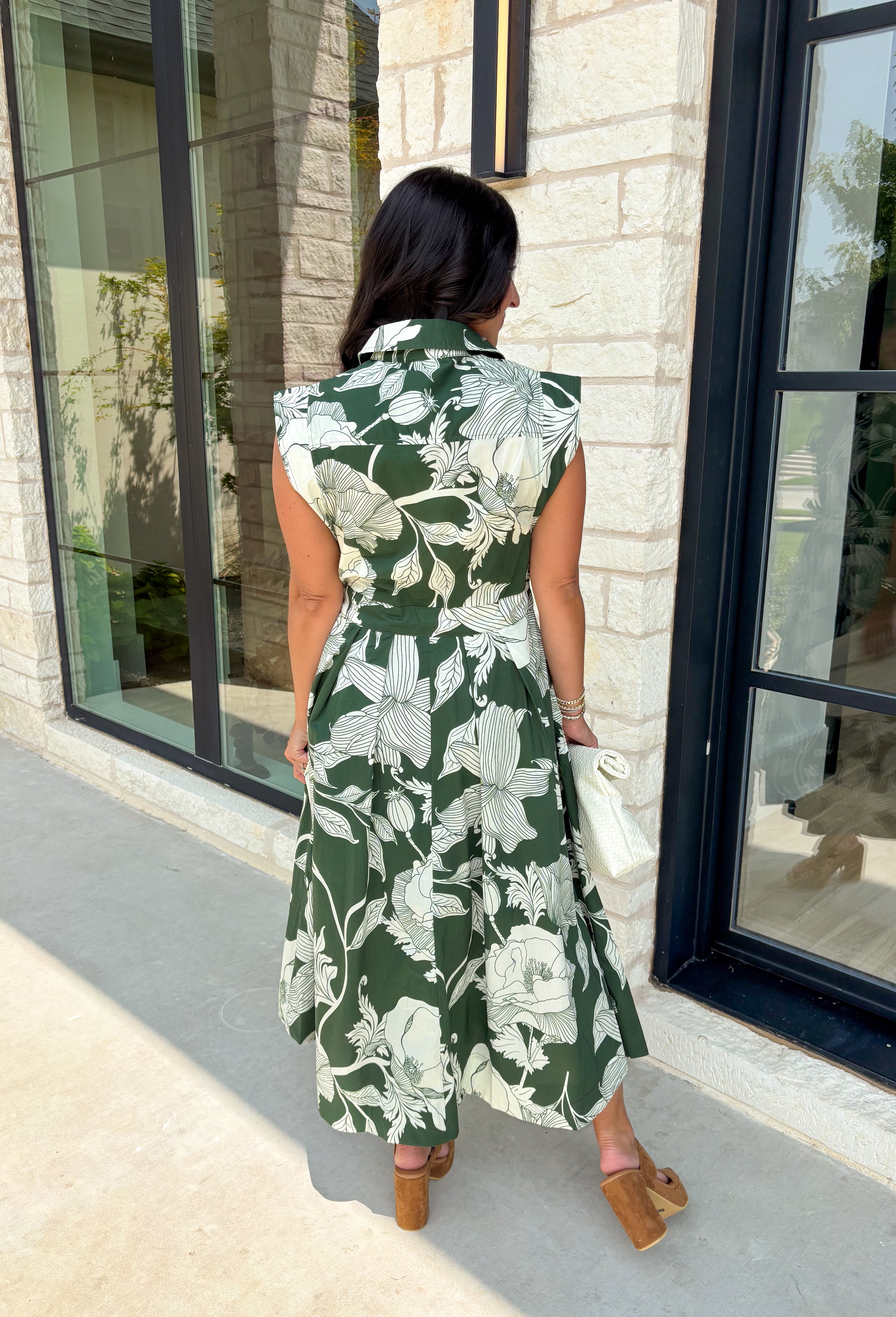 Fresh florals and timeless details come together in this effortlessly beautiful midi dress that's ready for every occasion on your calendar! Designed in a rich fern green with a neutral floral print, this cotton dress brings an easy elegance to your everyday wardrobe. The button-front bodice, self-tie waist belt, and flowy midi silhouette create a flattering fit you'll love, while the side pockets and fully lined design make it as practical as it is pretty. 