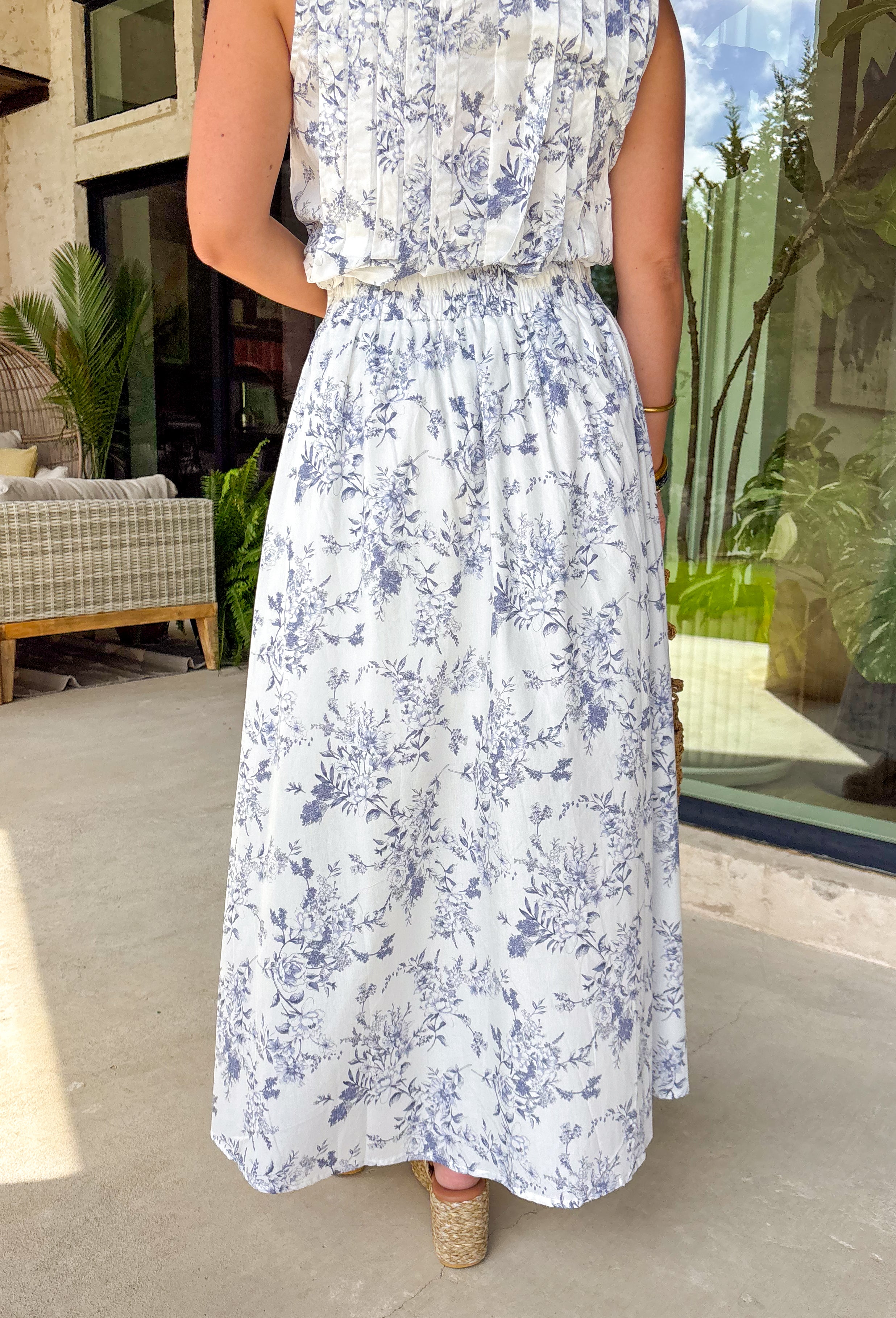 Crisp white and navy is always a yes! This matching midi skirt features a timeless navy floral print throughout for a fresh, polished look that’s perfect for sunny days. The flowy silhouette gives it beautiful movement, while the elastic waistband keeps it comfortable and easy to wear all day long. Lightweight in 100% cotton and effortlessly versatile, this skirt is perfect for everything from weekend brunch to vacation strolls. 