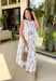 Crisp white and navy is always a yes! This sleeveless top features a timeless navy floral print throughout for a fresh, polished look that’s perfect for warm days. The three tie details along the top add a playful, feminine touch, while the soft pleating along the front gives it beautiful shape and movement. Lightweight in 100% cotton and easy to style, this top is perfect for everything from weekend brunch to vacation dinners.