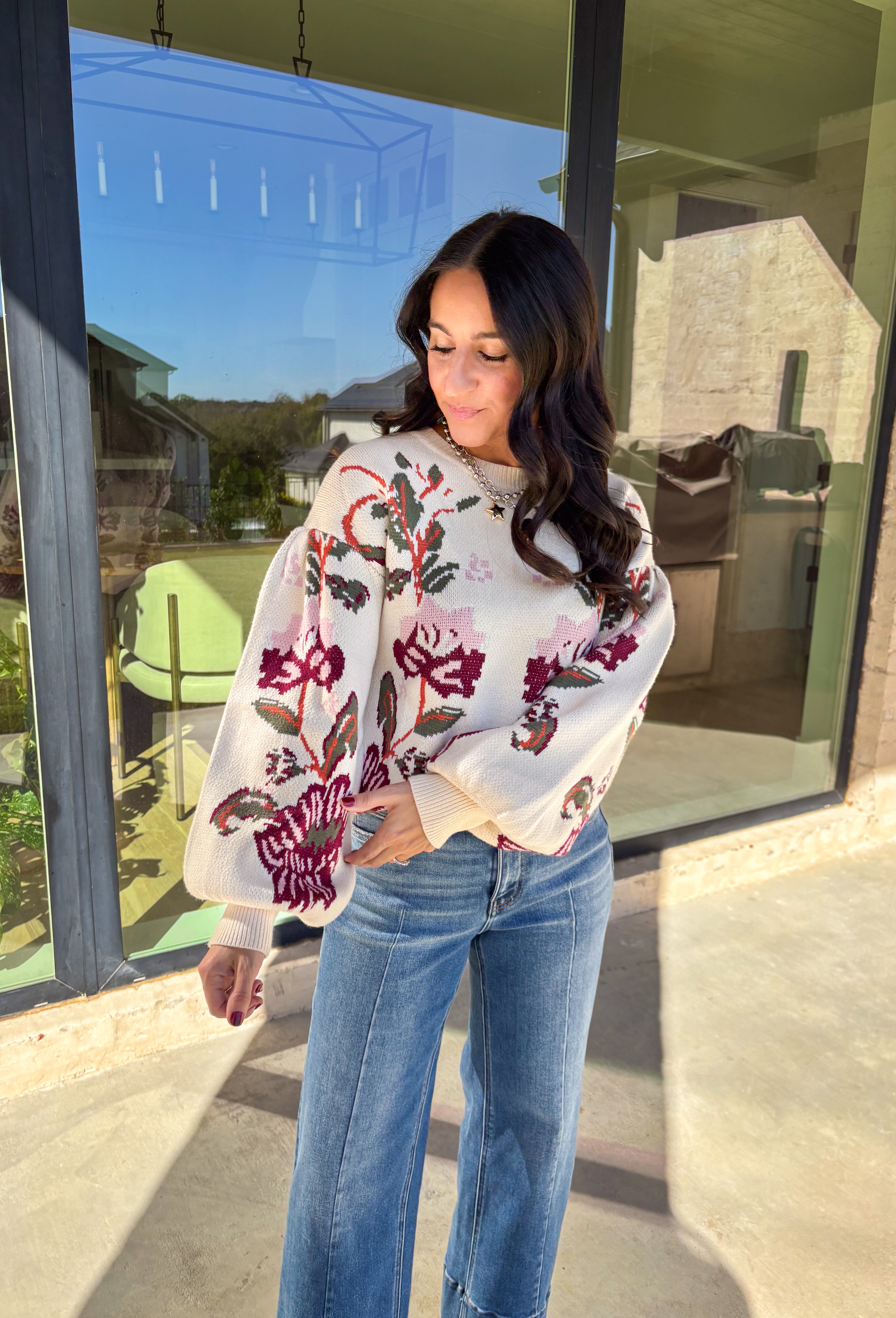 Bring a touch of warmth and charm to your winter wardrobe with this floral knit sweater by Voy. Designed in a soft cream base with blooms of hunter green, rust, burgundy, and light pink, this cozy knit perfectly captures the beauty of the season. The balloon sleeves add a stylish, relaxed shape, making it a perfect choice for everything from casual days to cozy evenings by the fire.