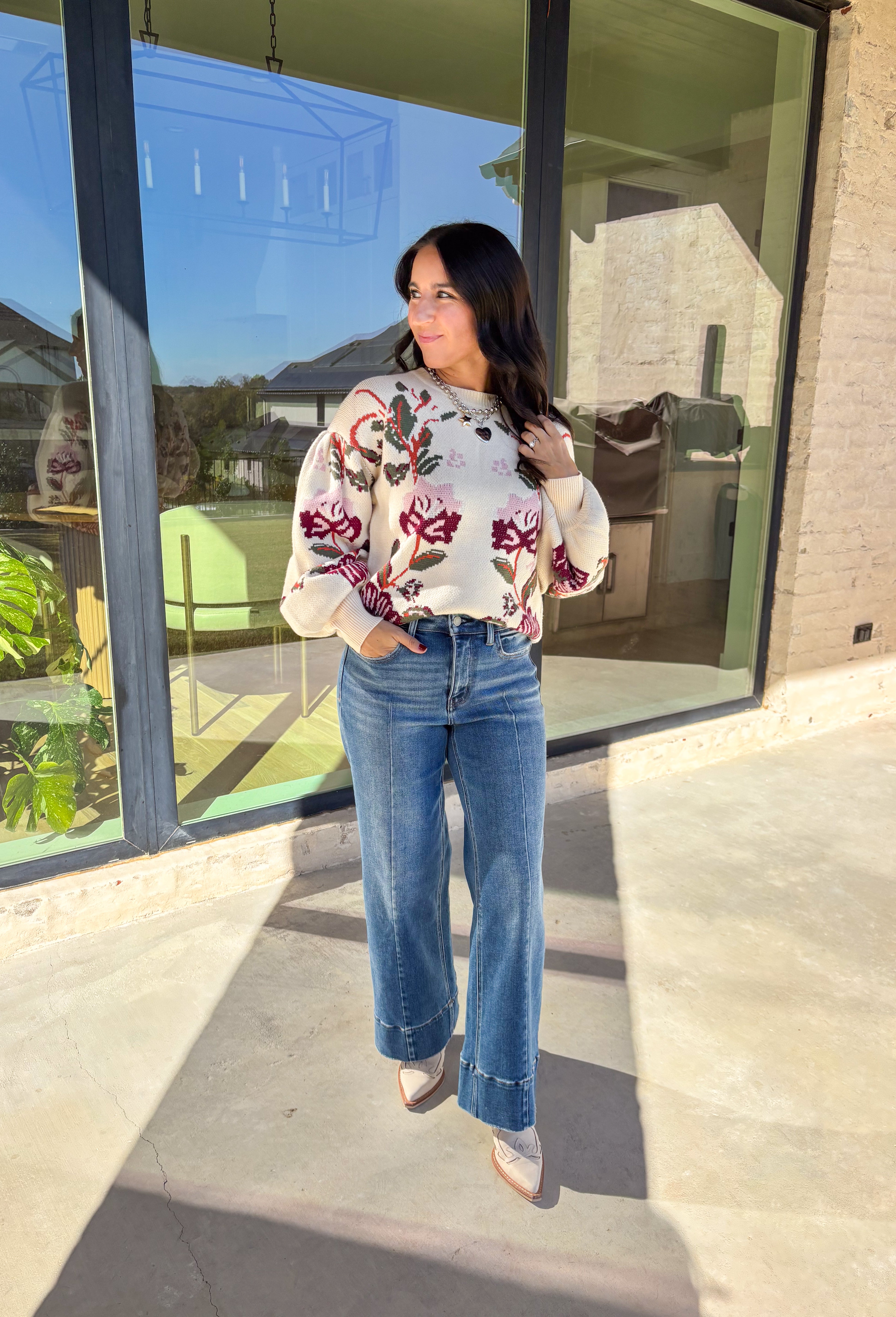 Bring a touch of warmth and charm to your winter wardrobe with this floral knit sweater by Voy. Designed in a soft cream base with blooms of hunter green, rust, burgundy, and light pink, this cozy knit perfectly captures the beauty of the season. The balloon sleeves add a stylish, relaxed shape, making it a perfect choice for everything from casual days to cozy evenings by the fire.