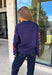 Wrap yourself in cozy comfort with a sweater that's bursting with beautiful seasonal color! This navy knit sweater is adorned with a vibrant floral motif featuring shades of coral, burgundy, olive green, and off white, creating the perfect blend of timeless charm and autumn style. The mock neckline and relaxed drop shoulders give it an effortlessly cozy feel, while the soft knit fabric makes it an easy choice for crisp mornings, weekend outings, and everything in between. 