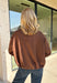 Elevate your layering game with this effortlessly chic faux suede jacket from Entro. Designed in a rich brown hue, this open-front jacket features a beautifully draped lapel that creates an elegant, flattering silhouette. The soft faux suede texture gives it a luxurious feel, while the comfortable stretch fabric makes it easy to wear from morning to night. Whether layered over dresses, blouses, or your favorite sweater, this timeless jacket is the perfect finishing touch for all your fall outfits.