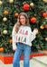 Add a playful pop of holiday cheer to your winter wardrobe with this cozy off-white sweater by Main Strip! Featuring “Fa La La La” embroidered across the front in colorful letters—each with its own fun print—this soft knit is full of festive spirit. Perfect for holiday parties, casual days, or cozy nights in, it’s the kind of merry piece you’ll wear all season long.