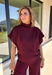Rich burgundy makes this matching set from Hyfve an easy choice for the transition from fall gatherings into the holiday season. The short sleeve mock neck top features ruching along the sides, adding texture and shape to the simple silhouette. Matching wide leg pants keep the look comfortable with an easy elastic waistband and plenty of movement.