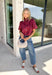 Rich autumn colors and feminine details make this striped blouse an effortless addition to your seasonal wardrobe. Featuring warm plum and rust stripes, this lightweight cotton top captures the beauty of fall while offering an easy, everyday silhouette you'll love. The banded neckline, puff sleeves, and button-front design create a polished look, while the shirring at the shoulders and back adds beautiful texture and a flattering drape. 