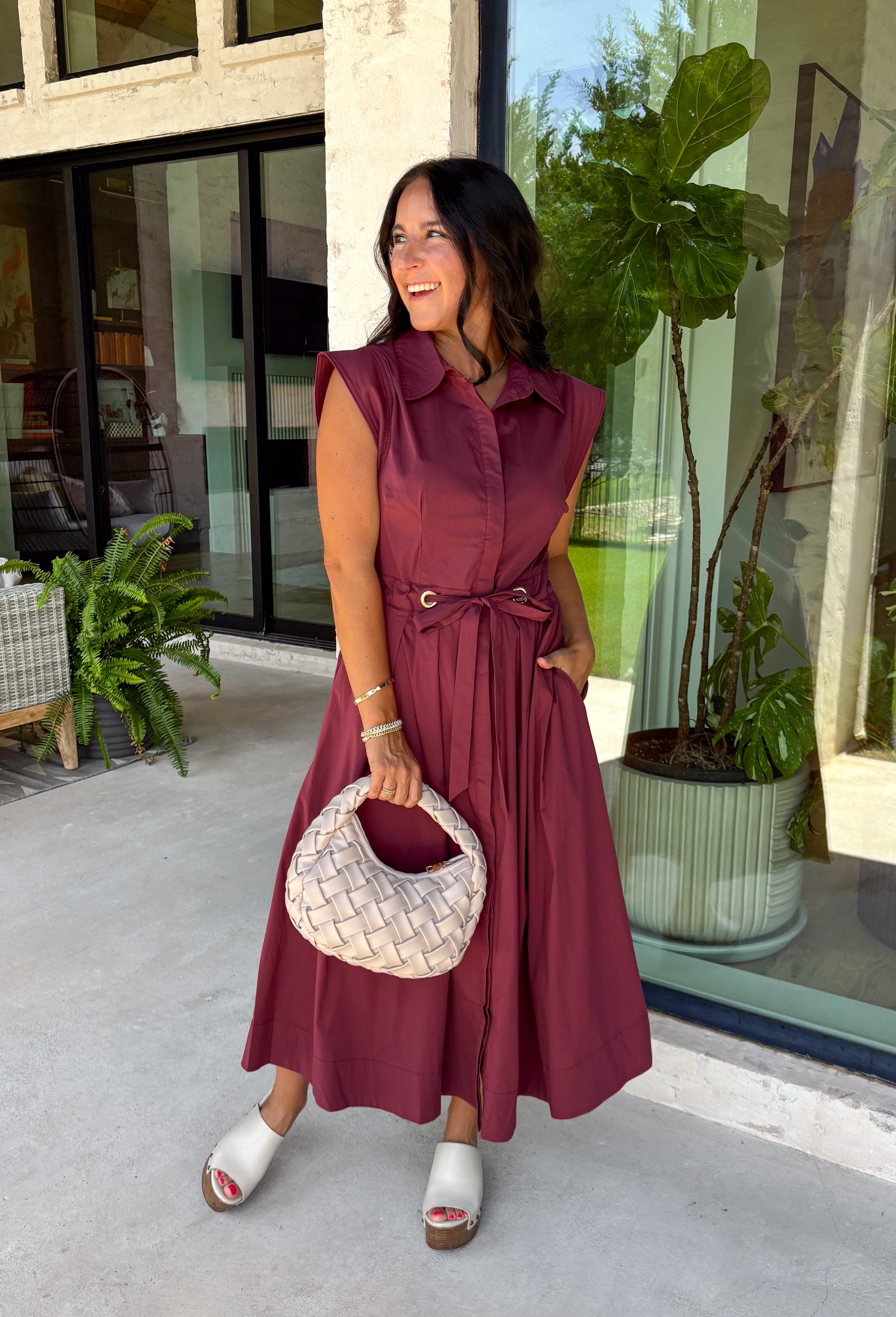Meet the dress you'll be reaching for all fall long! This rich burgundy midi dress is effortlessly polished with its classic collared neckline, button front, and flattering self-tie waist that lets you create the perfect fit. Finished with side pockets and a fully lined design, it's as practical as it is stylish. From office days and brunch dates to family gatherings and fall festivities, this timeless dress is ready for every occasion.