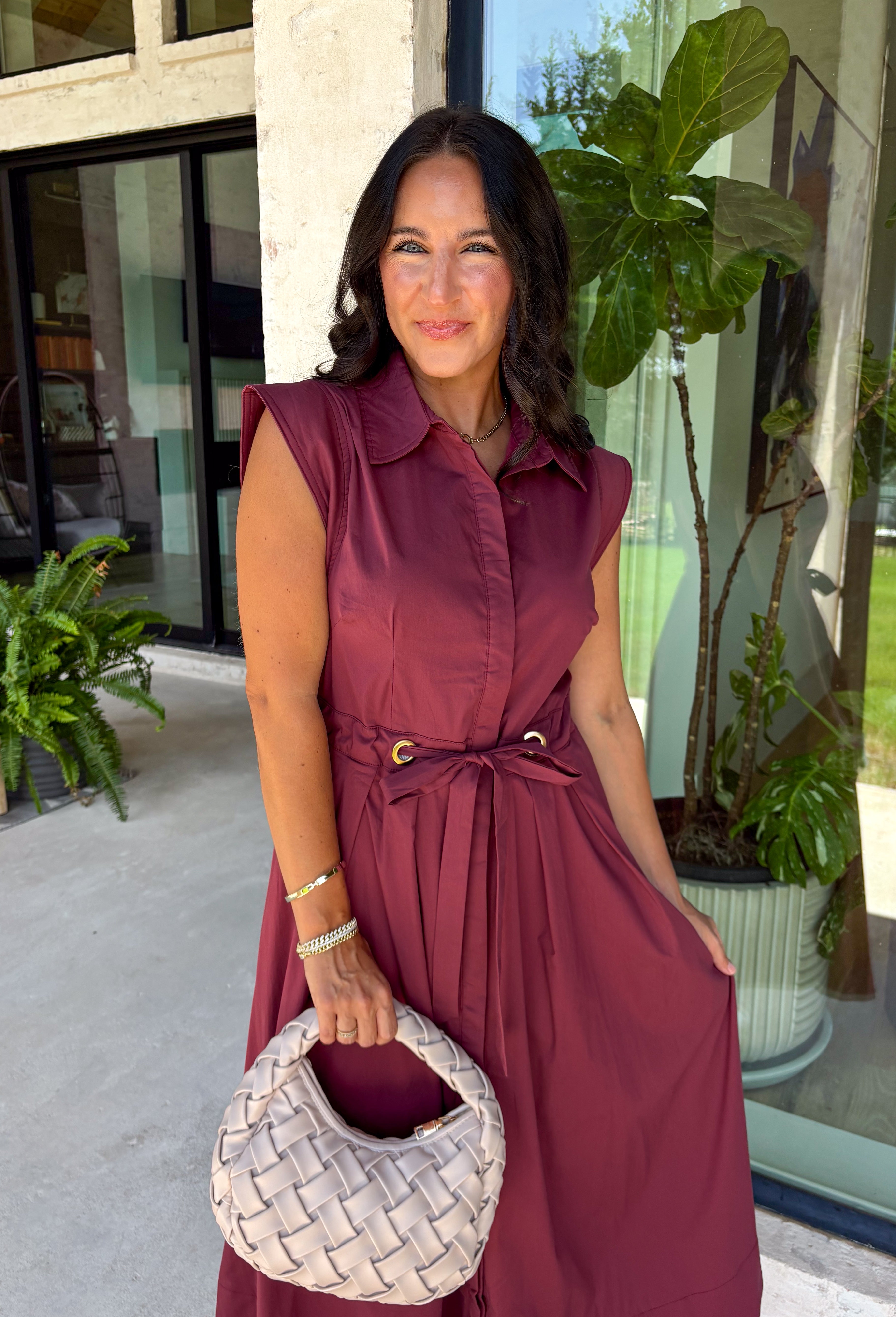 Meet the dress you'll be reaching for all fall long! This rich burgundy midi dress is effortlessly polished with its classic collared neckline, button front, and flattering self-tie waist that lets you create the perfect fit. Finished with side pockets and a fully lined design, it's as practical as it is stylish. From office days and brunch dates to family gatherings and fall festivities, this timeless dress is ready for every occasion.