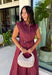 Meet the dress you'll be reaching for all fall long! This rich burgundy midi dress is effortlessly polished with its classic collared neckline, button front, and flattering self-tie waist that lets you create the perfect fit. Finished with side pockets and a fully lined design, it's as practical as it is stylish. From office days and brunch dates to family gatherings and fall festivities, this timeless dress is ready for every occasion.