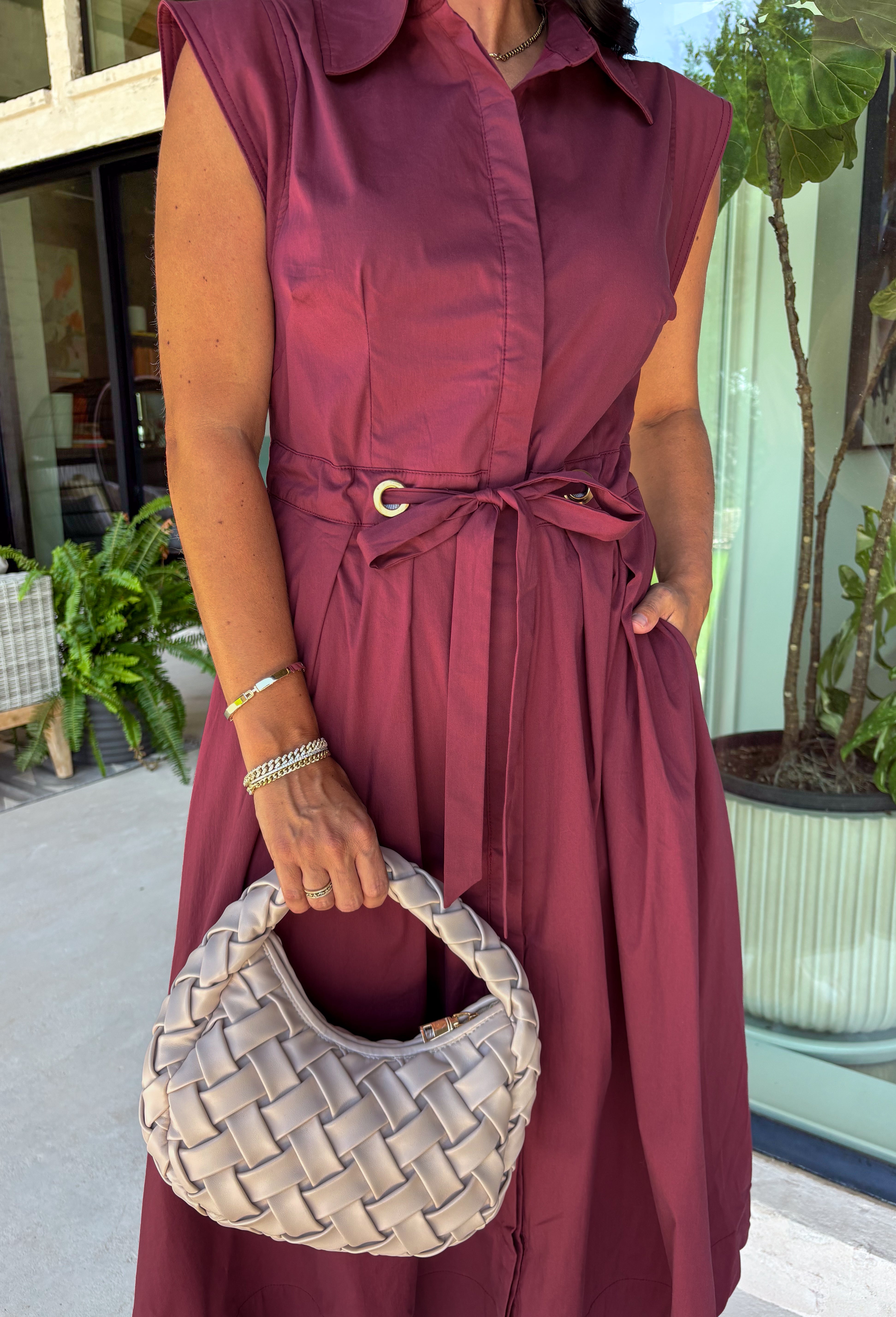 Meet the dress you'll be reaching for all fall long! This rich burgundy midi dress is effortlessly polished with its classic collared neckline, button front, and flattering self-tie waist that lets you create the perfect fit. Finished with side pockets and a fully lined design, it's as practical as it is stylish. From office days and brunch dates to family gatherings and fall festivities, this timeless dress is ready for every occasion.