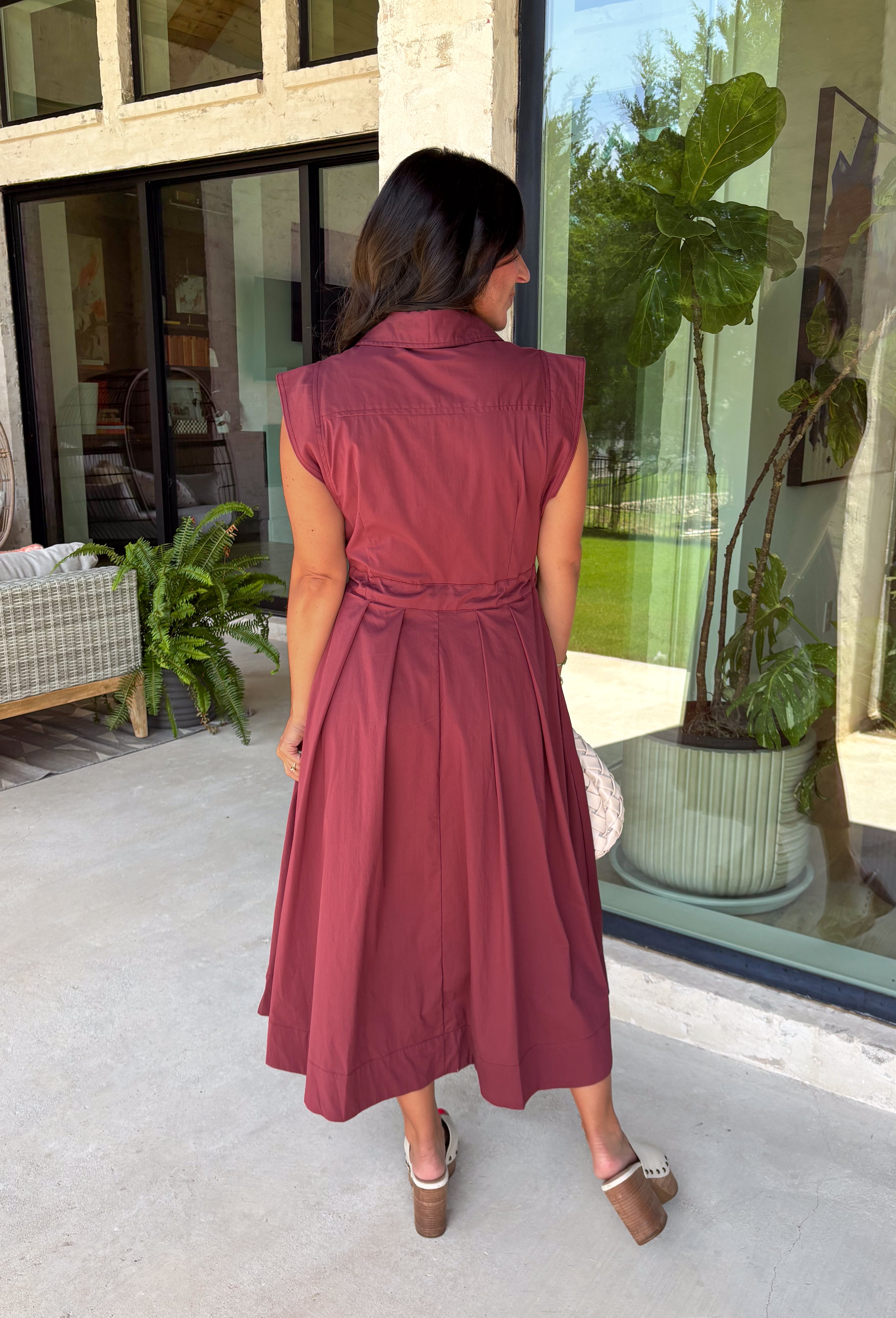 Meet the dress you'll be reaching for all fall long! This rich burgundy midi dress is effortlessly polished with its classic collared neckline, button front, and flattering self-tie waist that lets you create the perfect fit. Finished with side pockets and a fully lined design, it's as practical as it is stylish. From office days and brunch dates to family gatherings and fall festivities, this timeless dress is ready for every occasion.