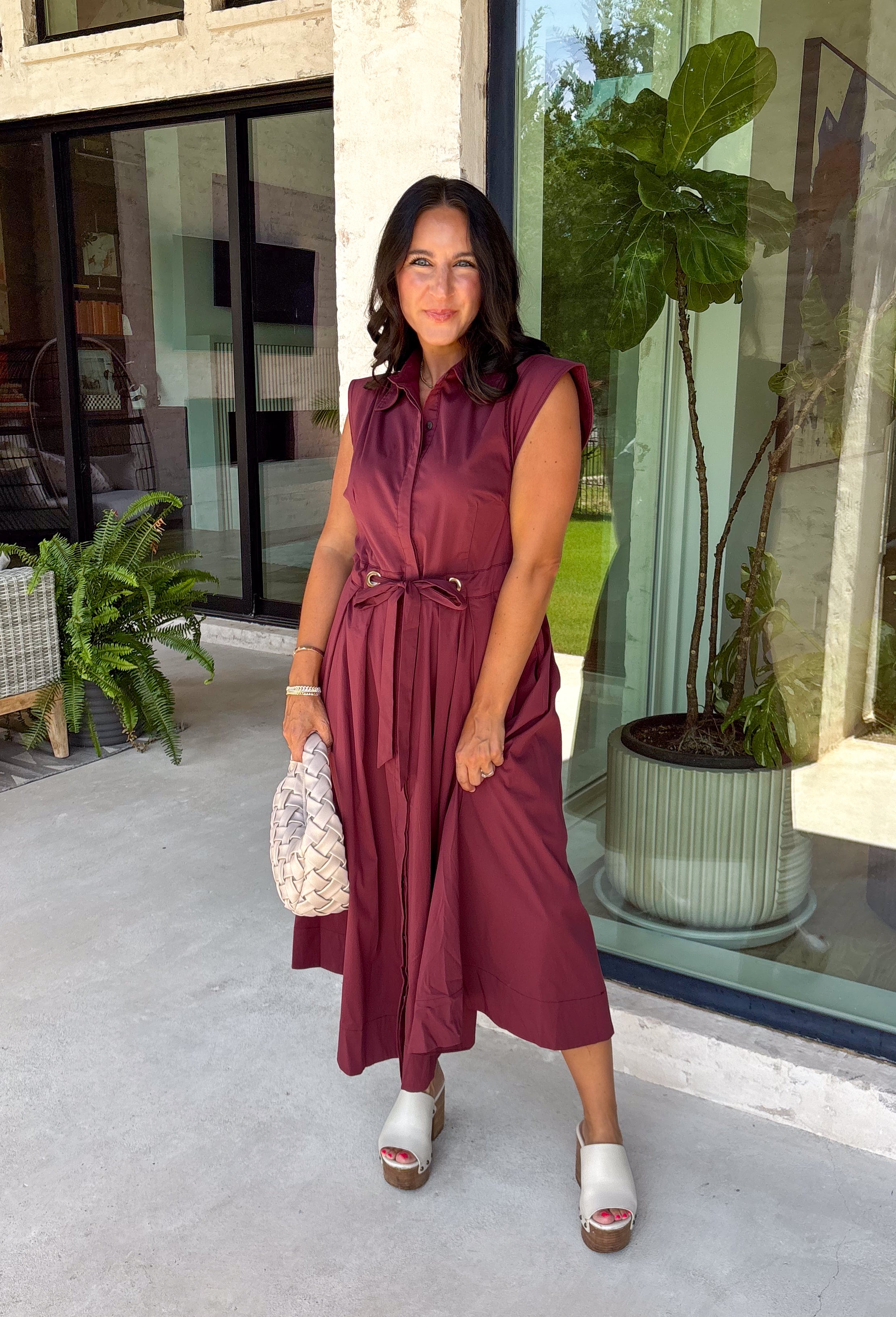 Meet the dress you'll be reaching for all fall long! This rich burgundy midi dress is effortlessly polished with its classic collared neckline, button front, and flattering self-tie waist that lets you create the perfect fit. Finished with side pockets and a fully lined design, it's as practical as it is stylish. From office days and brunch dates to family gatherings and fall festivities, this timeless dress is ready for every occasion.