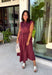 Meet the dress you'll be reaching for all fall long! This rich burgundy midi dress is effortlessly polished with its classic collared neckline, button front, and flattering self-tie waist that lets you create the perfect fit. Finished with side pockets and a fully lined design, it's as practical as it is stylish. From office days and brunch dates to family gatherings and fall festivities, this timeless dress is ready for every occasion.