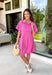 This pink dress is the perfect blend of classic and effortless for summer! The vibrant pink color makes a statement while still being easy to wear, and the stitch detailing along the front placket adds a subtle touch of texture and charm. Designed with a hidden button front, it has a clean, polished look that feels timeless and versatile. Fully lined with side pockets (always a win), it’s comfortable enough for everyday wear while still looking put together.