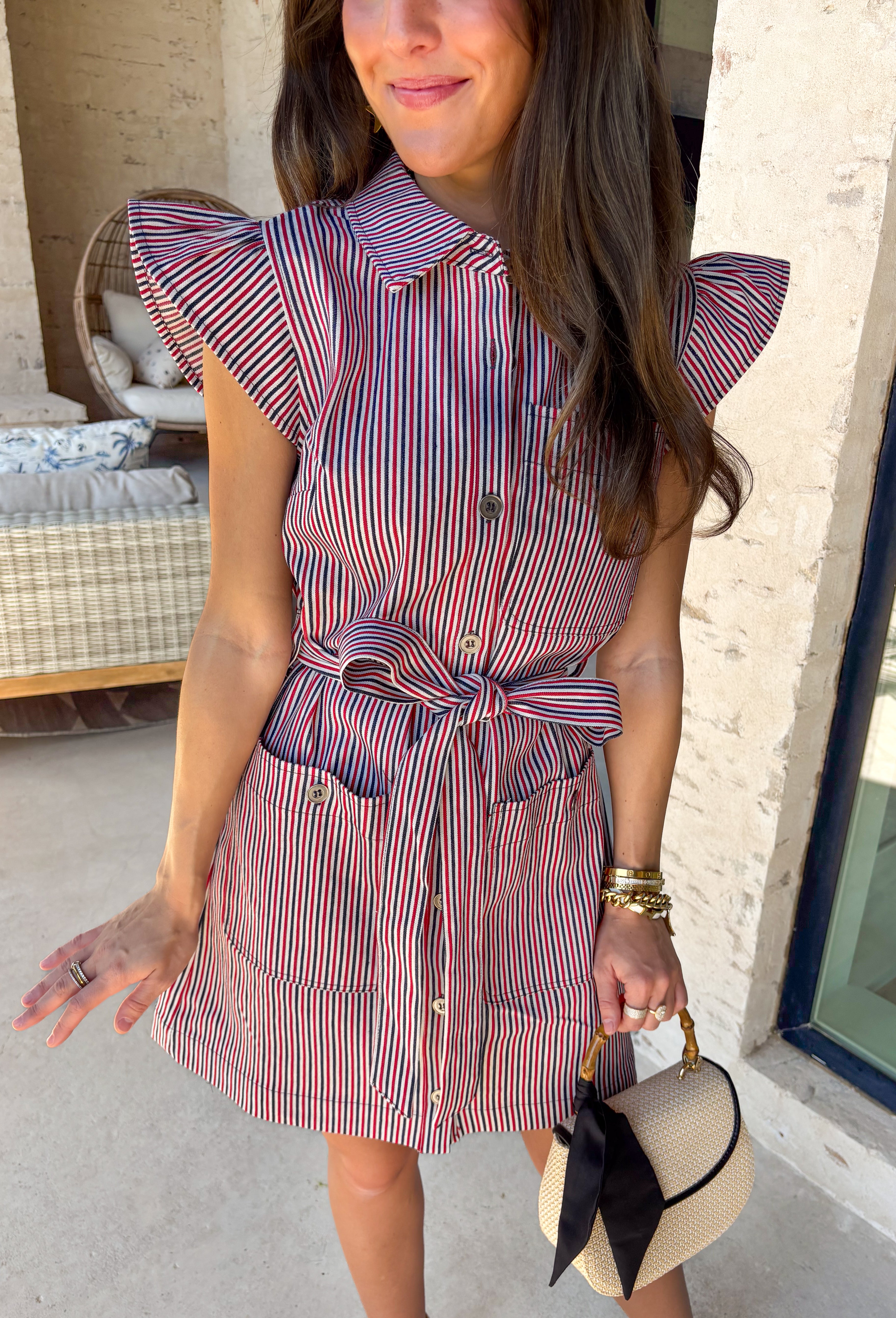 Classic with a patriotic twist! This red, white, and navy stripe button down dress is the perfect blend of timeless and fun. The crisp stripe pattern paired with a collared neckline gives it that polished shirt dress feel, while still being easy and wearable for everyday. Designed with a matching self-tie belt to cinch the waist, this dress creates a flattering silhouette you can adjust to your liking. Front pockets add a practical touch, and the lightweight fabric keeps it comfortable all day long. 