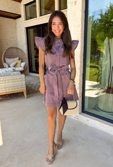 Classic with a patriotic twist! This red, white, and navy stripe button down dress is the perfect blend of timeless and fun. The crisp stripe pattern paired with a collared neckline gives it that polished shirt dress feel, while still being easy and wearable for everyday. Designed with a matching self-tie belt to cinch the waist, this dress creates a flattering silhouette you can adjust to your liking. Front pockets add a practical touch, and the lightweight fabric keeps it comfortable all day long. 