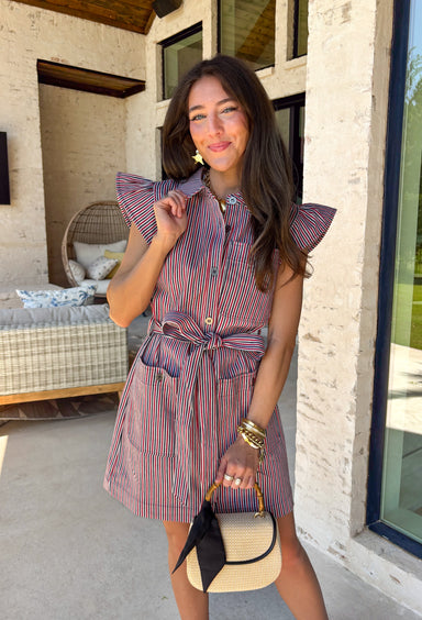 Classic with a patriotic twist! This red, white, and navy stripe button down dress is the perfect blend of timeless and fun. The crisp stripe pattern paired with a collared neckline gives it that polished shirt dress feel, while still being easy and wearable for everyday. Designed with a matching self-tie belt to cinch the waist, this dress creates a flattering silhouette you can adjust to your liking. Front pockets add a practical touch, and the lightweight fabric keeps it comfortable all day long. 