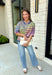 Who says fall has to be all neutrals? This cozy knit cardigan brings a cheerful burst of color to your seasonal wardrobe with bold stripes in green, pink, purple, yellow, blue, and orange. The button-down design gives you endless styling options—wear it buttoned as a sweater or open over your favorite basics for an effortless layered look. Crafted from a soft, cozy knit, it's the perfect piece to brighten crisp autumn days while keeping you comfortable from morning coffee runs to weekend adventures.