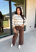 Wrap yourself in cozy comfort with this timeless sweater from Hyfve. Designed in a soft oatmeal knit, this effortlessly stylish sweater features a vintage-inspired stripe pattern in warm shades of tan and brown for the perfect touch of seasonal charm. The relaxed silhouette and soft knit make it an easy piece to throw on for crisp fall days, while the classic design ensures you'll wear it year after year. 