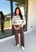 Wrap yourself in cozy comfort with this timeless sweater from Hyfve. Designed in a soft oatmeal knit, this effortlessly stylish sweater features a vintage-inspired stripe pattern in warm shades of tan and brown for the perfect touch of seasonal charm. The relaxed silhouette and soft knit make it an easy piece to throw on for crisp fall days, while the classic design ensures you'll wear it year after year. 