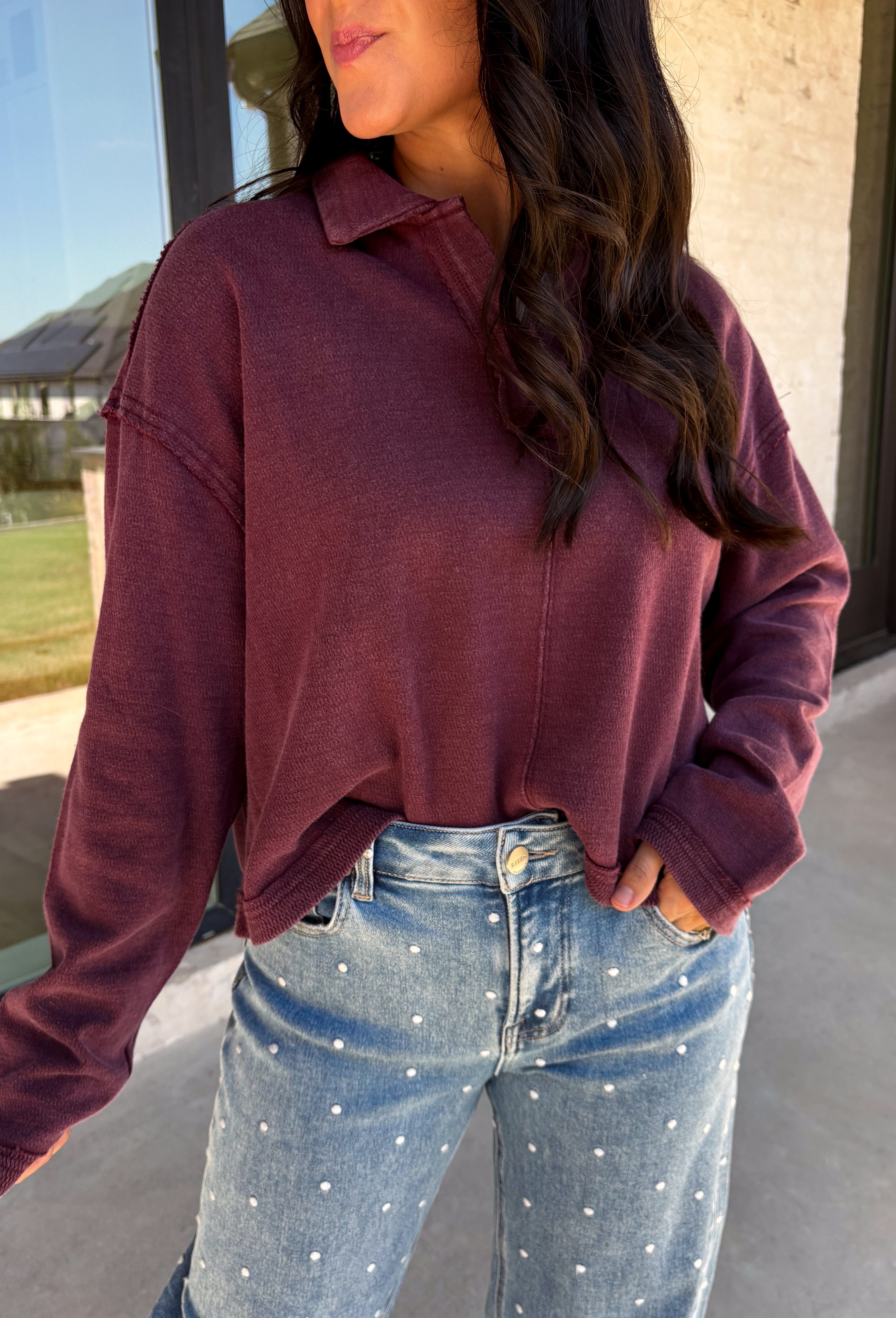 Elevate your everyday wardrobe with this effortlessly stylish top from Double Zero. Designed in a rich dark cherry hue, this versatile piece features a classic collared neckline that adds a polished touch to its relaxed silhouette. Exposed seam detailing gives it a modern, lived-in look, while the soft 100% cotton fabric keeps it comfortable enough for all-day wear. Whether you're headed to work, running errands, or meeting friends for coffee, this timeless top is an easy favorite for the season.