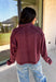 Elevate your everyday wardrobe with this effortlessly stylish top from Double Zero. Designed in a rich dark cherry hue, this versatile piece features a classic collared neckline that adds a polished touch to its relaxed silhouette. Exposed seam detailing gives it a modern, lived-in look, while the soft 100% cotton fabric keeps it comfortable enough for all-day wear. Whether you're headed to work, running errands, or meeting friends for coffee, this timeless top is an easy favorite for the season.
