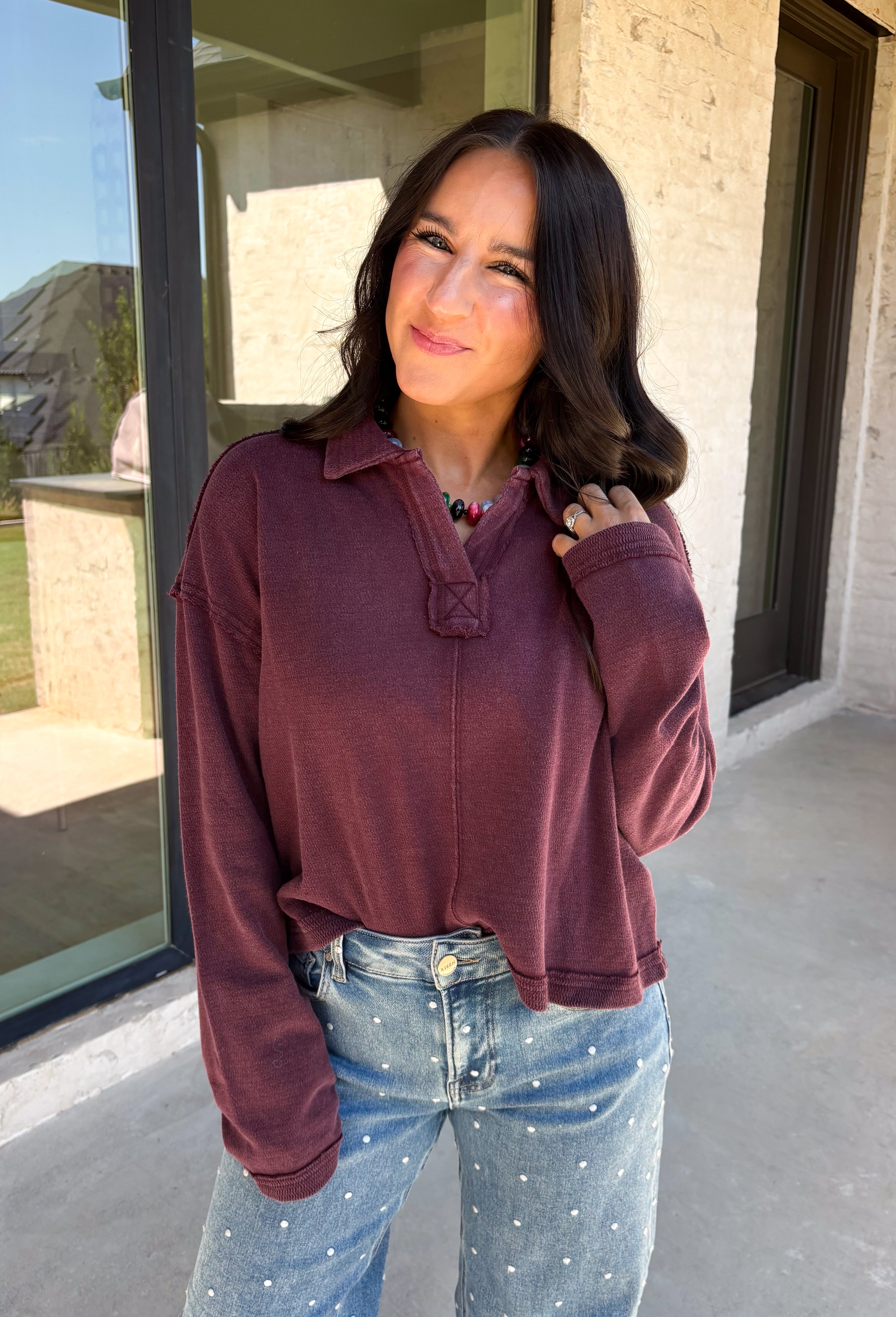 Elevate your everyday wardrobe with this effortlessly stylish top from Double Zero. Designed in a rich dark cherry hue, this versatile piece features a classic collared neckline that adds a polished touch to its relaxed silhouette. Exposed seam detailing gives it a modern, lived-in look, while the soft 100% cotton fabric keeps it comfortable enough for all-day wear. Whether you're headed to work, running errands, or meeting friends for coffee, this timeless top is an easy favorite for the season.