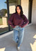 Elevate your everyday wardrobe with this effortlessly stylish top from Double Zero. Designed in a rich dark cherry hue, this versatile piece features a classic collared neckline that adds a polished touch to its relaxed silhouette. Exposed seam detailing gives it a modern, lived-in look, while the soft 100% cotton fabric keeps it comfortable enough for all-day wear. Whether you're headed to work, running errands, or meeting friends for coffee, this timeless top is an easy favorite for the season.