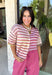 Who says fall has to be all neutrals? This cozy knit cardigan brings a cheerful burst of color to your seasonal wardrobe with bold stripes in shades of berries. The button-down design gives you endless styling options—wear it buttoned as a sweater or open over your favorite basics for an effortless layered look. Crafted from a soft, cozy knit, it's the perfect piece to brighten crisp autumn days while keeping you comfortable from morning coffee runs to weekend adventures.