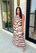 Turn heads this season in a midi dress that's equal parts bold and timeless. Featuring a neutral backdrop with an eye-catching black and orange tiger stripe print, this dress makes a statement while remaining effortlessly wearable. The belted waist creates a flattering silhouette, while side pockets and a fully lined design add comfort and practicality. Whether you're headed to brunch, family photos, or a fall event, this standout dress is ready for every occasion on your calendar.