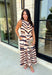 Turn heads this season in a midi dress that's equal parts bold and timeless. Featuring a neutral backdrop with an eye-catching black and orange tiger stripe print, this dress makes a statement while remaining effortlessly wearable. The belted waist creates a flattering silhouette, while side pockets and a fully lined design add comfort and practicality. Whether you're headed to brunch, family photos, or a fall event, this standout dress is ready for every occasion on your calendar.
