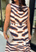 Turn heads this season in a midi dress that's equal parts bold and timeless. Featuring a neutral backdrop with an eye-catching black and orange tiger stripe print, this dress makes a statement while remaining effortlessly wearable. The belted waist creates a flattering silhouette, while side pockets and a fully lined design add comfort and practicality. Whether you're headed to brunch, family photos, or a fall event, this standout dress is ready for every occasion on your calendar.