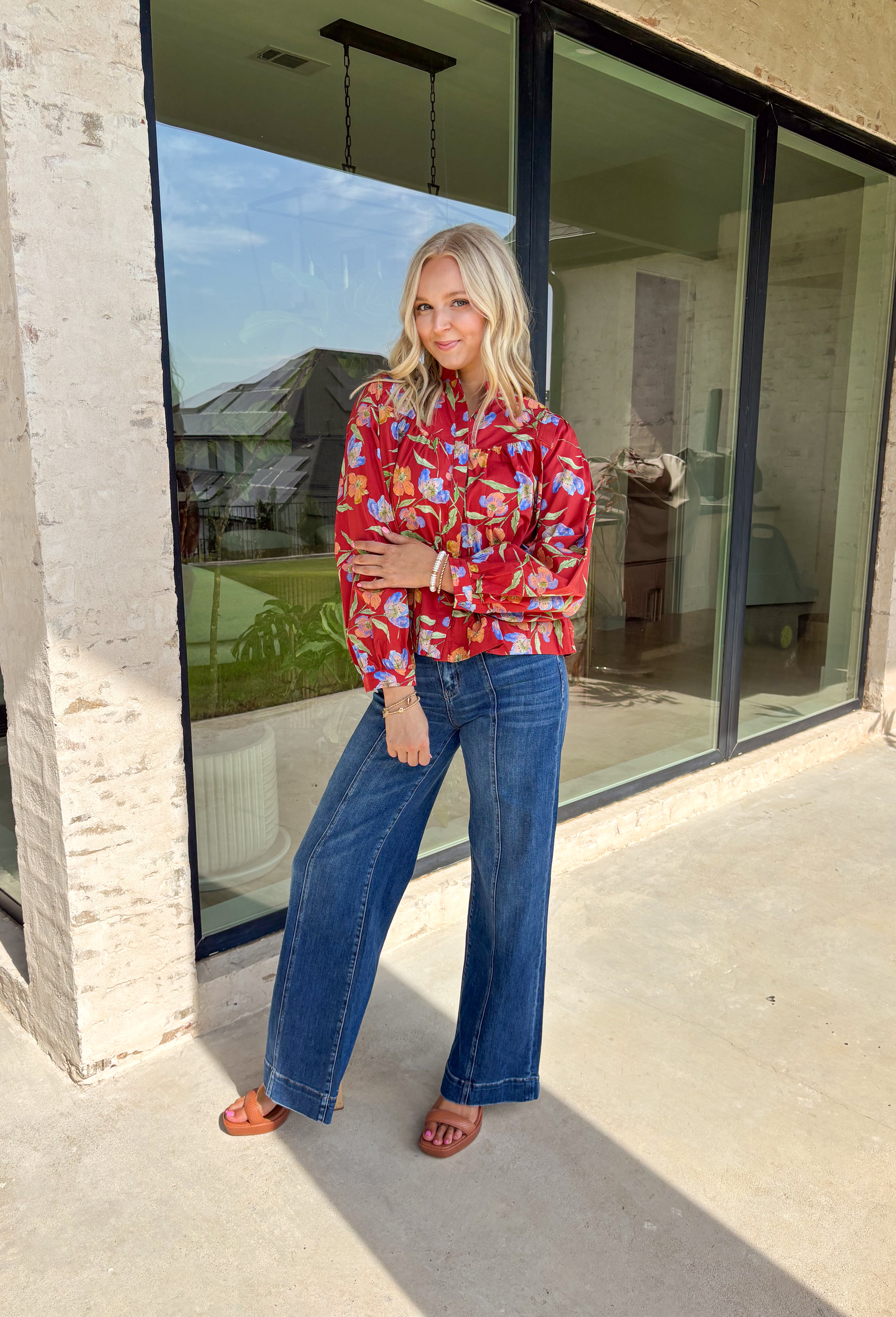 This autumn-ready floral blouse brings all the charm of the season in one lightweight layer. With its rich botanical print and crisp collar, this top feels timeless but with an elevated twist thanks to the hidden button placket and cuff band long sleeves. It’s a closet staple you'll be reaching for from pumpkin spice runs to Thanksgiving dinner.