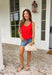 Add a pop of bold spring color to your closet with this red button down sweater tank by Wishlist! The open knit texture keeps it light and breathable, while the button-front design makes it easy to style solo or layered over a simple cami. Finished with the cutest scalloped hem and a tie detail at the bottom, this piece gives you that “effortlessly put together” look with just the right amount of playful charm. Pair it with light wash denim for an easy daytime outfit.