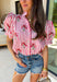 Nothing says sweet spring style quite like red and white stripes paired with cheerful florals. This striped short puff sleeve top by Entro brings playful charm and feminine detail together in the prettiest way. The classic red and white stripe base is brightened up with pink, red, green, and blue floral embroidery that adds texture, color, and that extra-special touch. Designed with a flattering button-front closure and soft puff sleeves, this top feels polished yet easy to wear. 