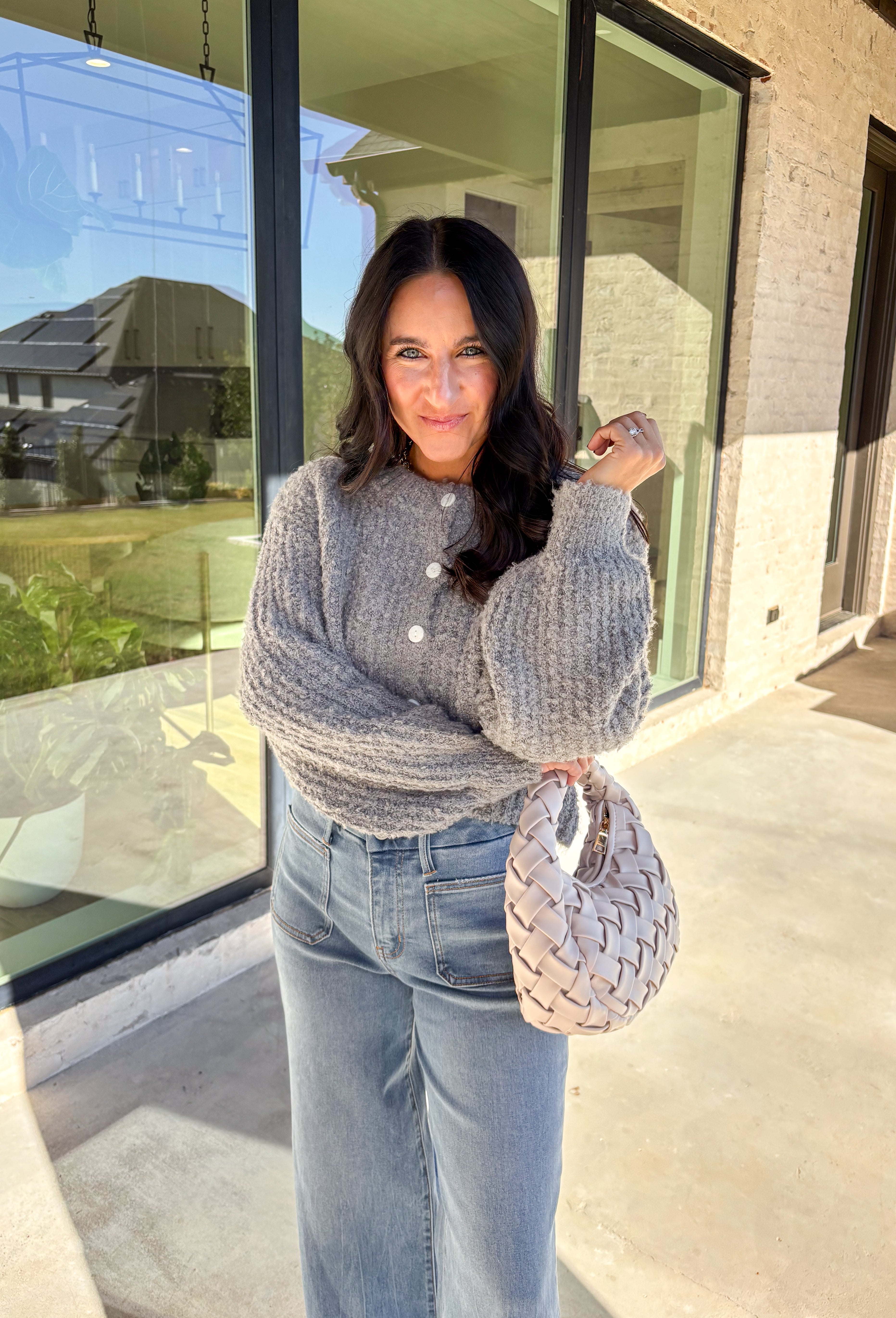 Soft, cozy, and perfectly cropped—this heather gray cardigan by Double Zero is a closet must-have for the season. The button-down front and relaxed fit make it effortlessly versatile, while the ultra-soft fabric keeps it comfy for all-day wear. Ideal for layering over your favorite tanks or pairing with high-rise denim, this cozy cutie is ready for fall days and nights in.