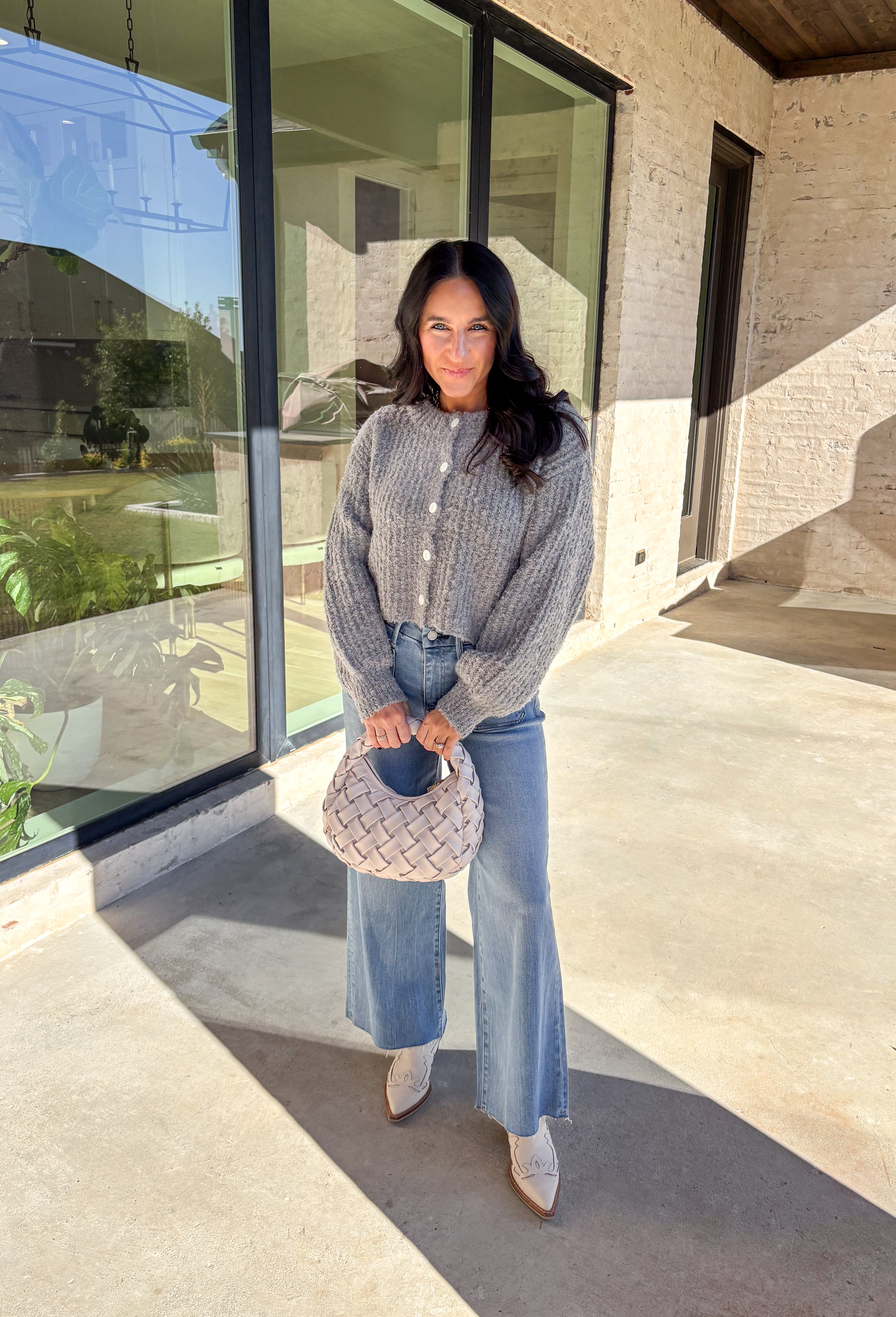 Soft, cozy, and perfectly cropped—this heather gray cardigan by Double Zero is a closet must-have for the season. The button-down front and relaxed fit make it effortlessly versatile, while the ultra-soft fabric keeps it comfy for all-day wear. Ideal for layering over your favorite tanks or pairing with high-rise denim, this cozy cutie is ready for fall days and nights in.