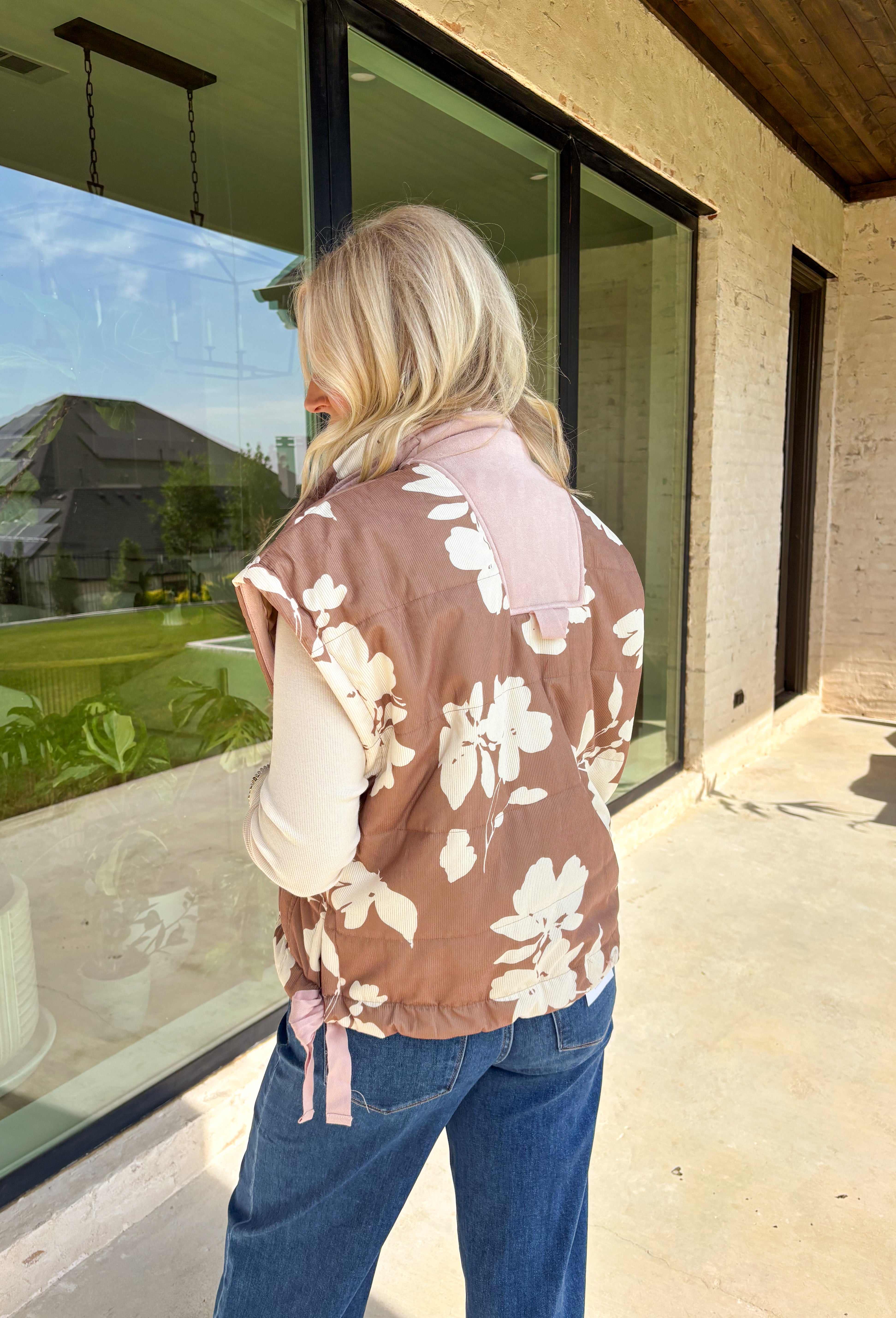 Say hello to your new favorite layering piece for fall! This brown ribbed vest features a vintage-inspired neutral floral print with soft light pink suede accents that run along the front for just the right pop of texture. With side ties, front pockets, and a classic button-down design, it’s equal parts cozy and charming.