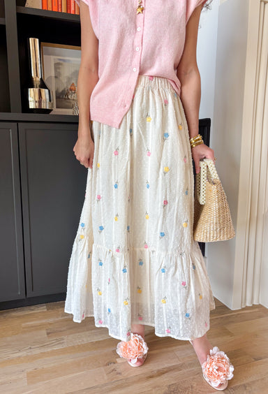 If happiness were a skirt, this would be it! This off white swiss dot midi skirt is sprinkled with the prettiest embroidered florals in butter yellow, light blue, light pink, and green — basically everything we love about spring wrapped into one easy, feminine piece. The textured swiss dot fabric adds soft dimension, while the colorful floral embroidery brings it to life. An elastic waistband keeps it comfortable and flattering, and the full lining makes it effortless to wear. 
