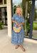 This blue striped midi dress is the perfect blend of classic and cheerful for summer! The blue stripe print creates a timeless foundation, while the yellow floral pattern adds a bright, sunny pop that instantly stands out. Designed with a collared neckline and button front closure, it has a polished feel that's easy to dress up or down. The adjustable drawstring waist creates a flattering silhouette, and side pockets make it even better. 